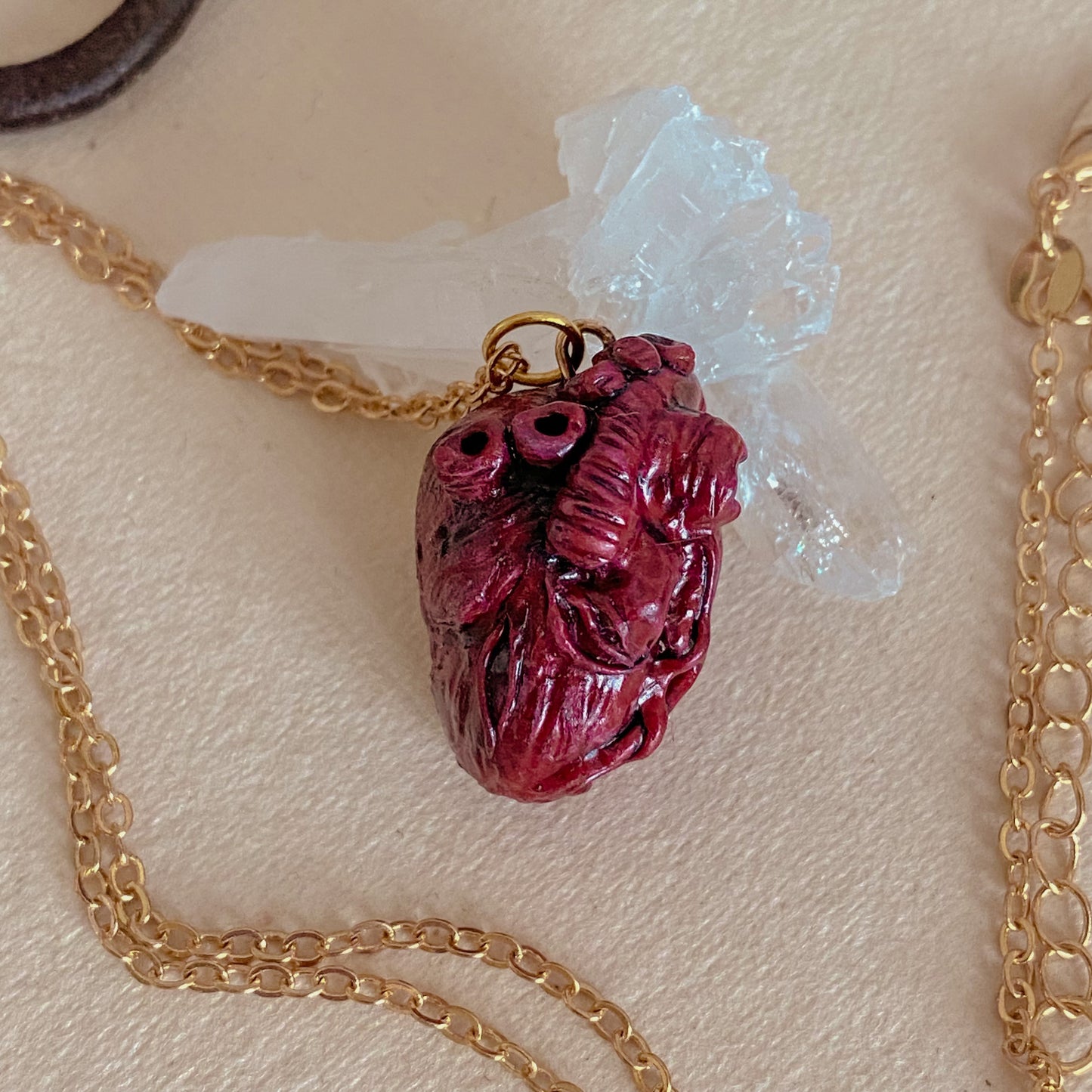 "Bloody Valentine" hand-sculpted anatomical heart pendant.