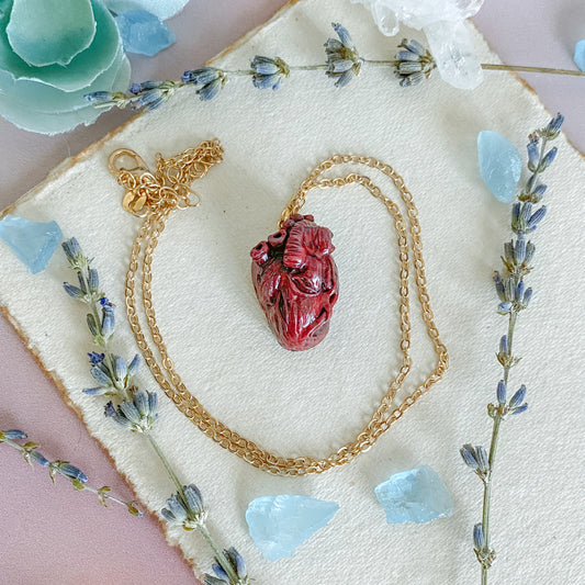 "Bloody Valentine" hand-sculpted anatomical heart pendant.