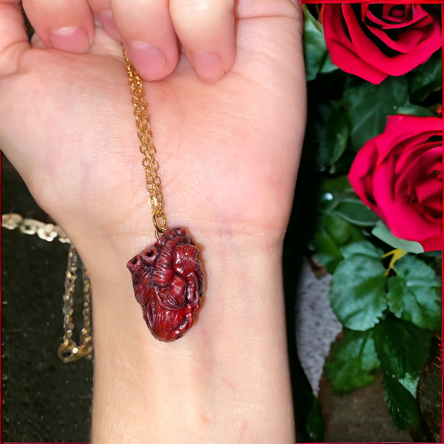 "Bloody Valentine" hand-sculpted anatomical heart pendant.